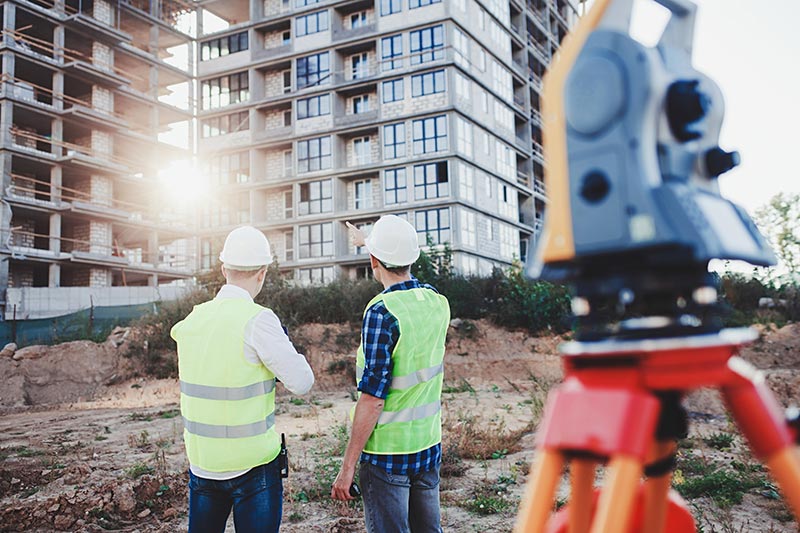 Building surveyors working on new apartment construction